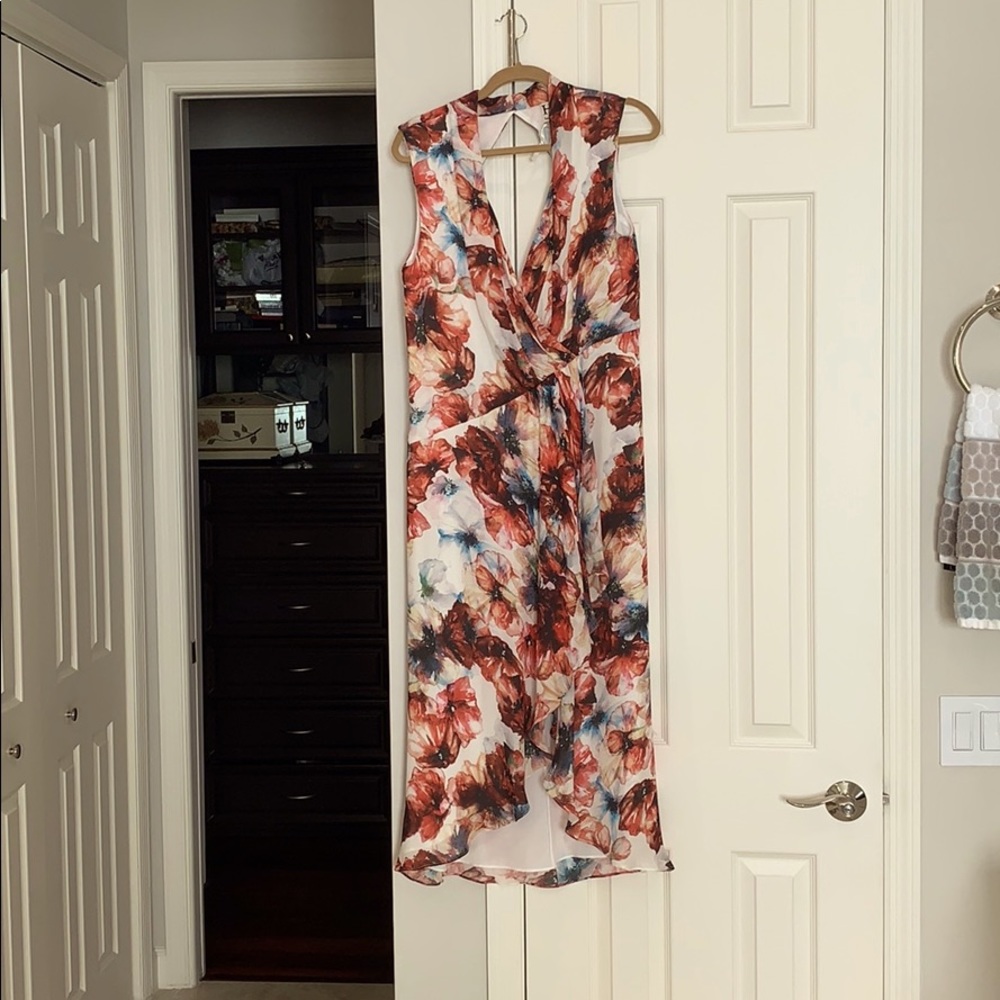 Never warn flowered high low, 100% silk dress.